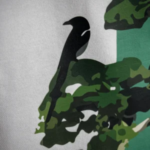 zoomed Back view of the Bonsai Tree T-Shirt showing a green vertical stripe with an artistic bonsai tree and crow graphic, printed on white fabric.