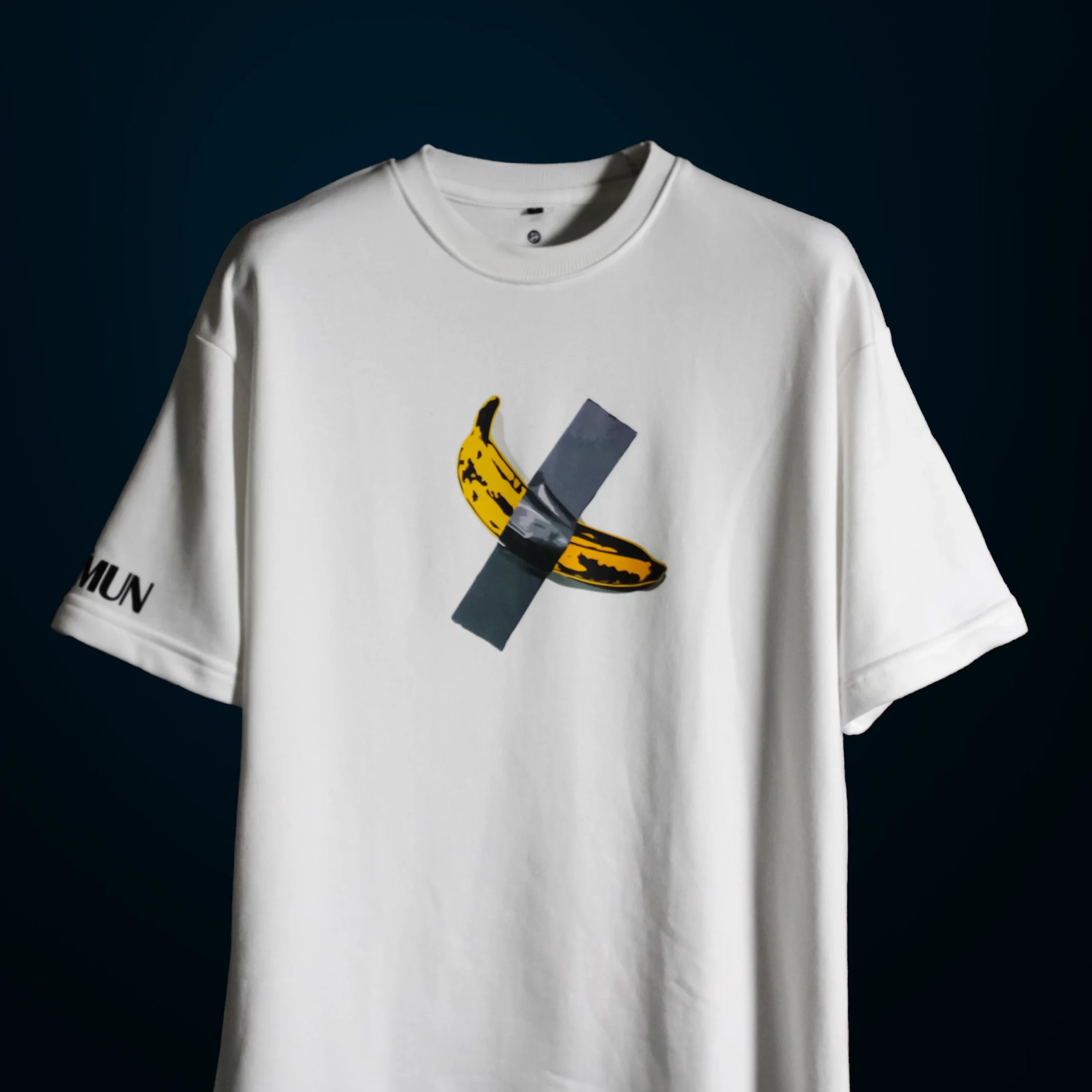 Detailed view of the high-density duct-taped banana graphic on the $6 Million Banana T-Shirt, showcasing the texture and print quality.