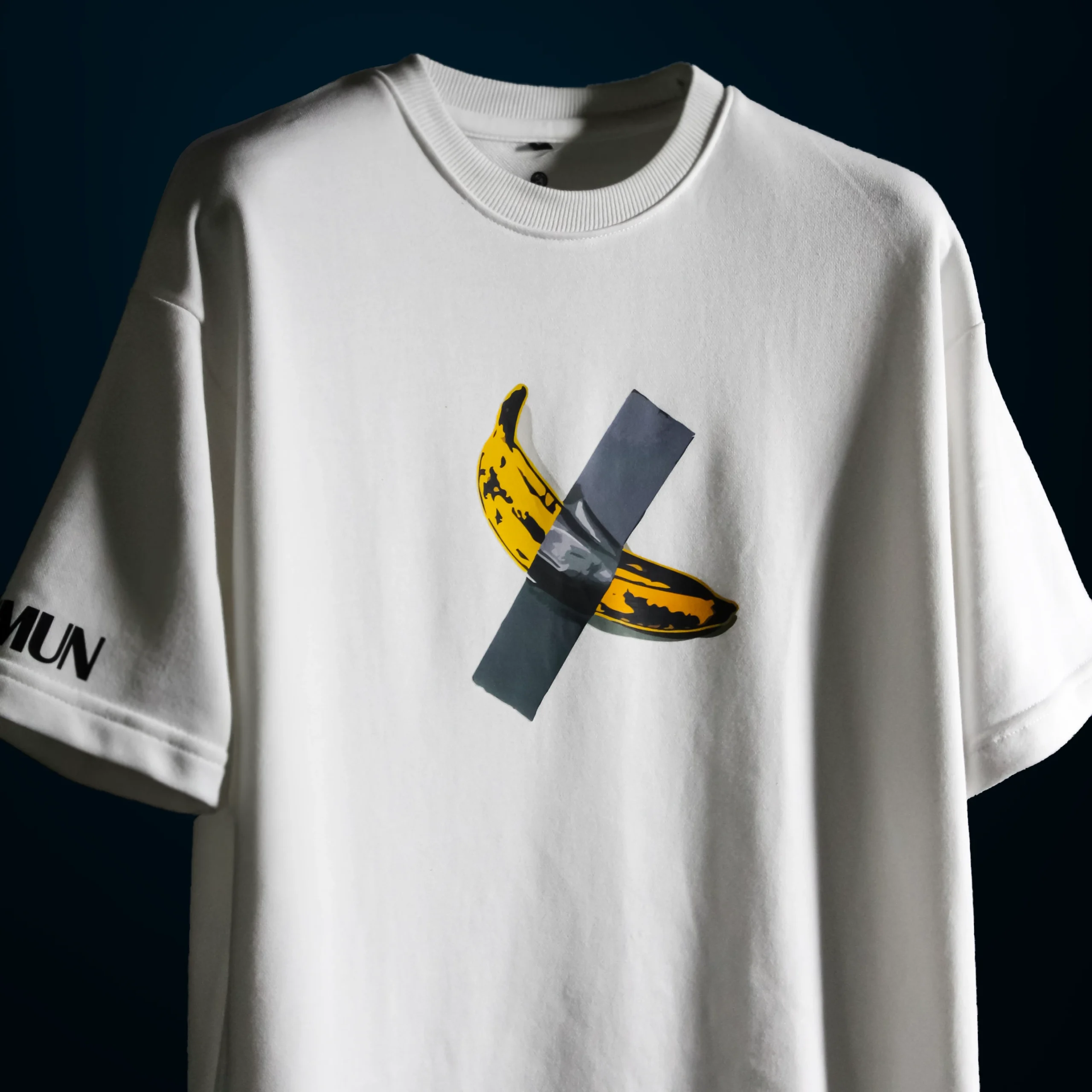 Detailed view of the high-density duct-taped banana graphic on the $6 Million Banana T-Shirt, showcasing the texture and print quality.