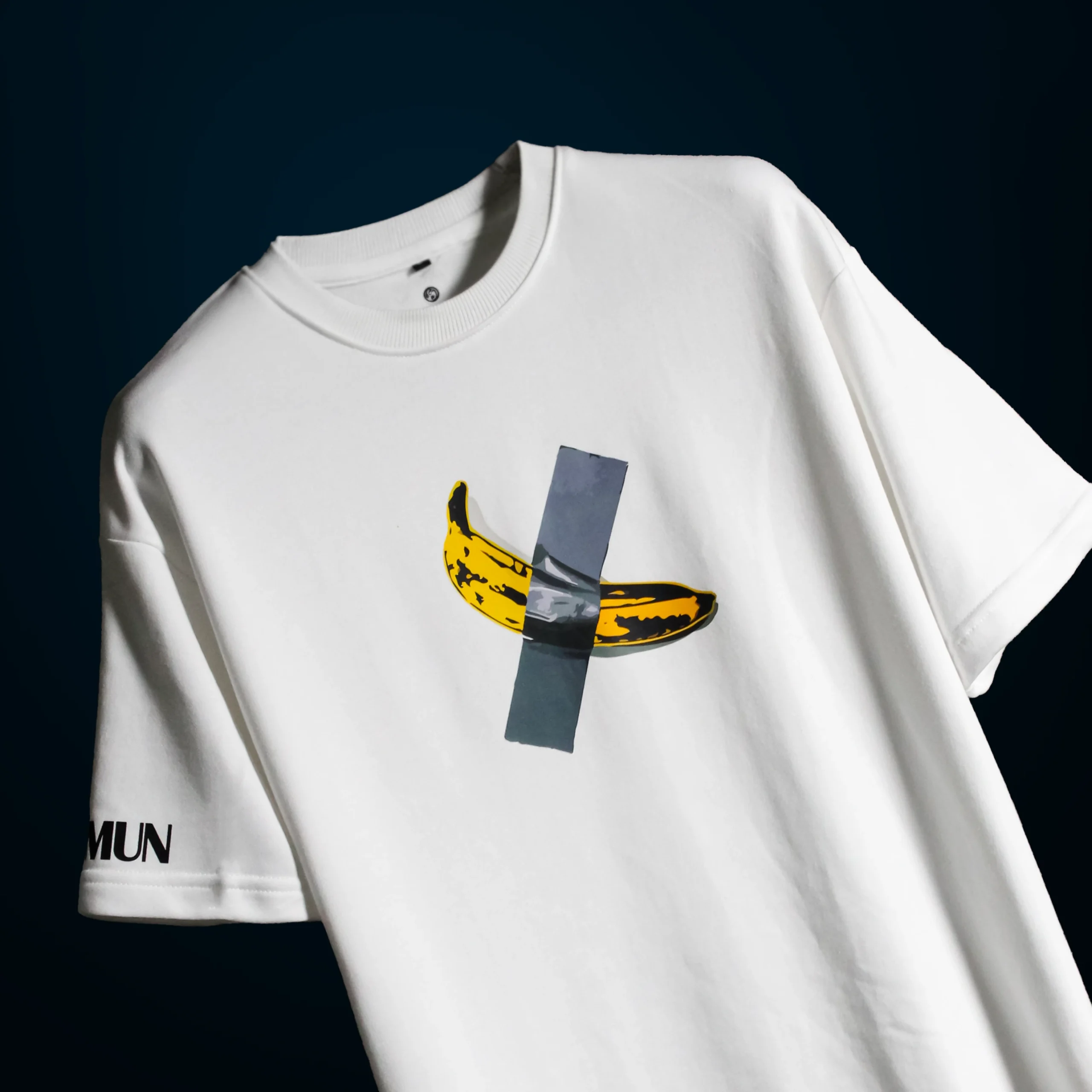 Detailed view of the high-density duct-taped banana graphic on the $6 Million Banana T-Shirt, showcasing the texture and print quality.