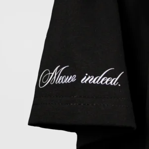 Close-up of shoulder of black flirting cat oversized t-shirt