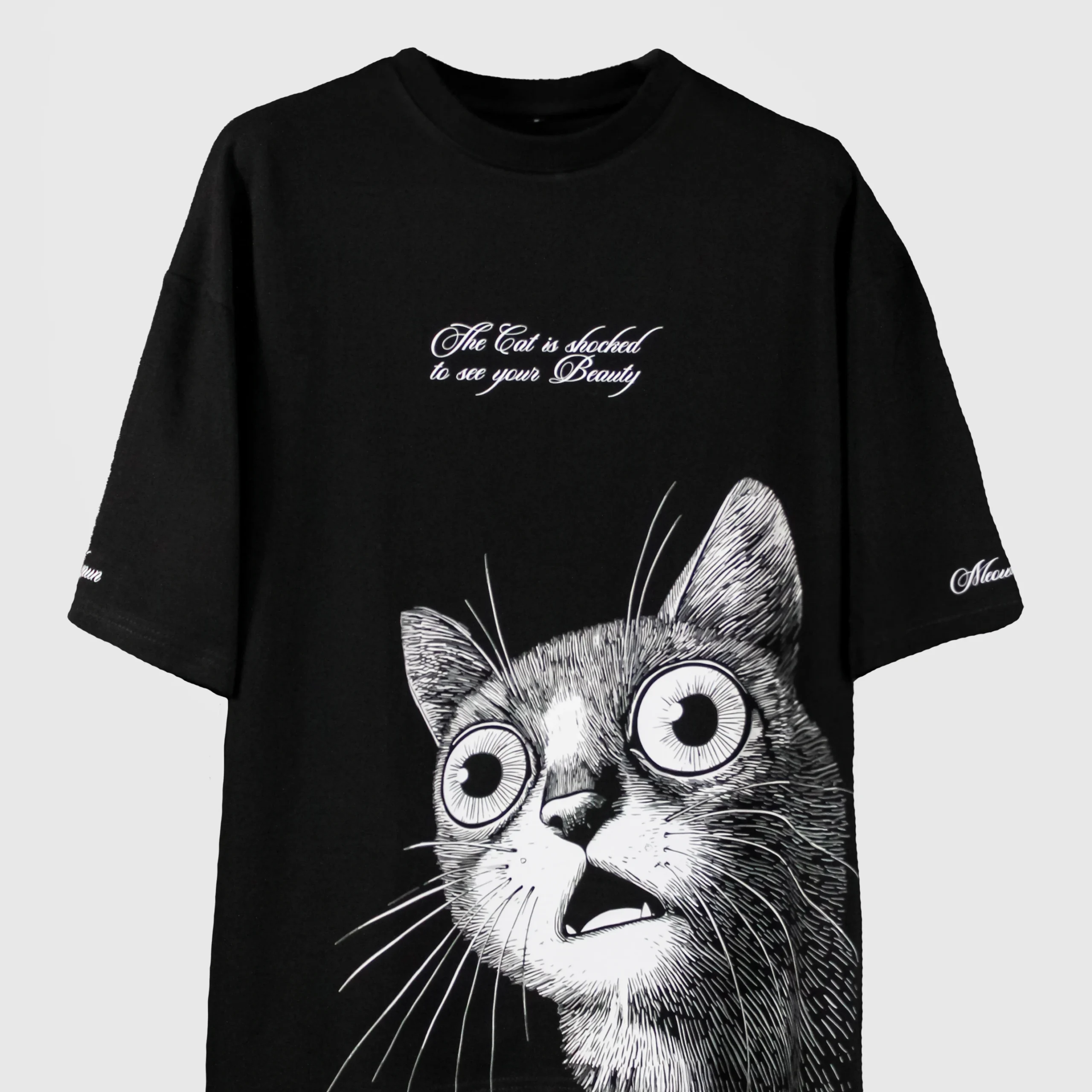 Oversized black t-shirt with shocked cat graphic and romantic quote – quirky streetwear for cat lovers and bold fashion statements