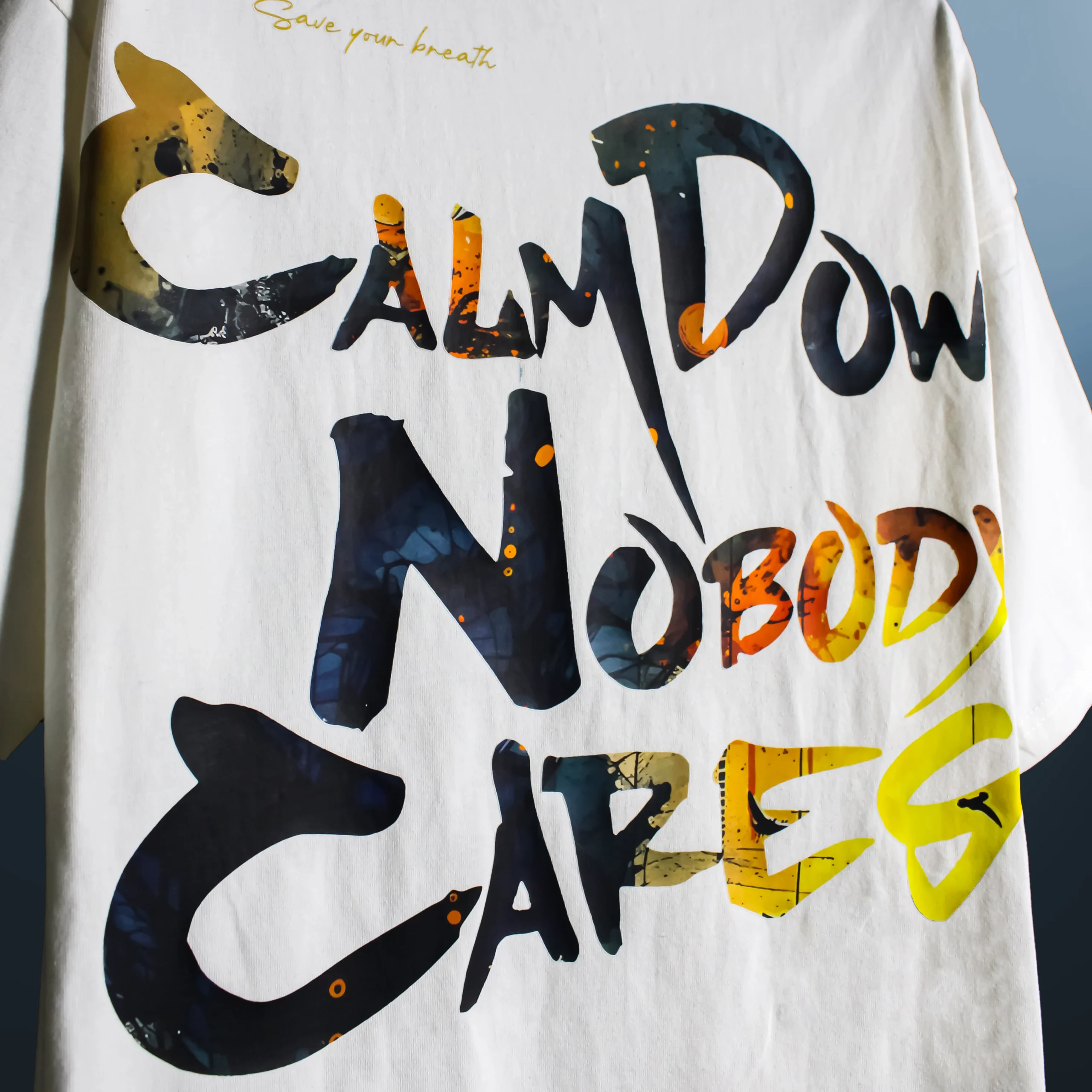 Calm Down Nobody Cares T‑Shirt back view down extreme close up