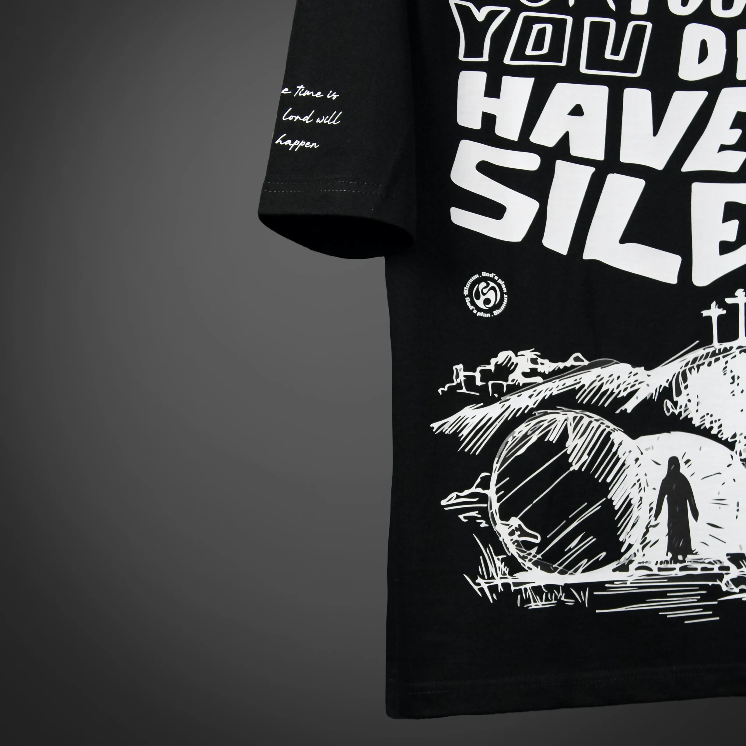 Extreme zoomed left Back view of the GOD'S PLAN oversized t-shirt featuring bold white biblical verse text in stylised hand-drawn font. Premium streetwear t-shirt | oversized t-shirt by BLUMUN